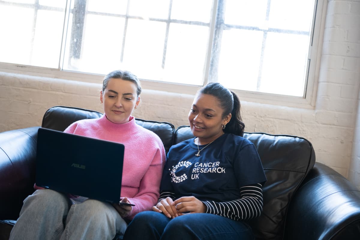 Two ladies looking at laptop.