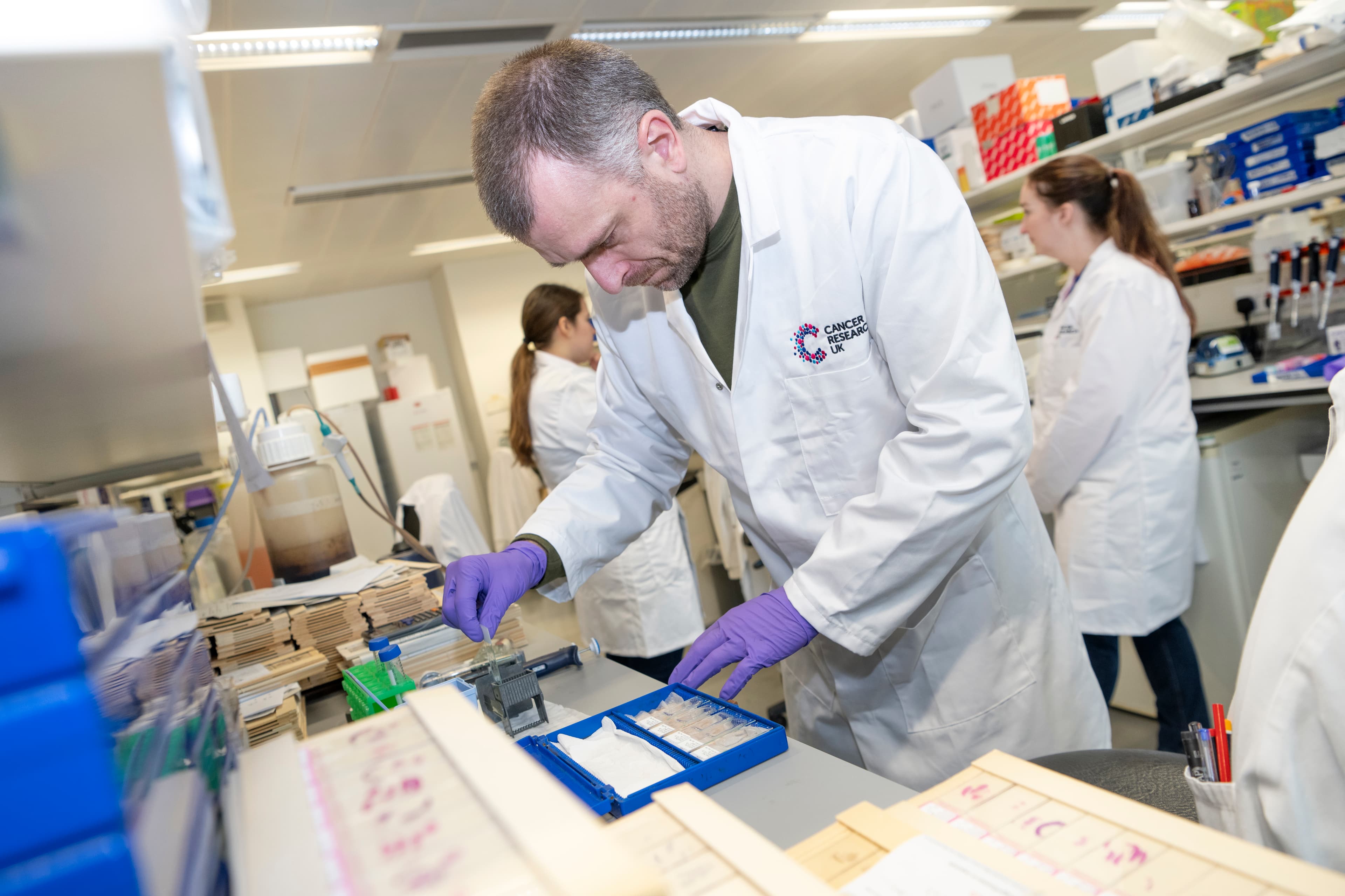 A photo of a researcher working in a lab.