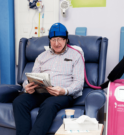 Photograph of man with cold cap.