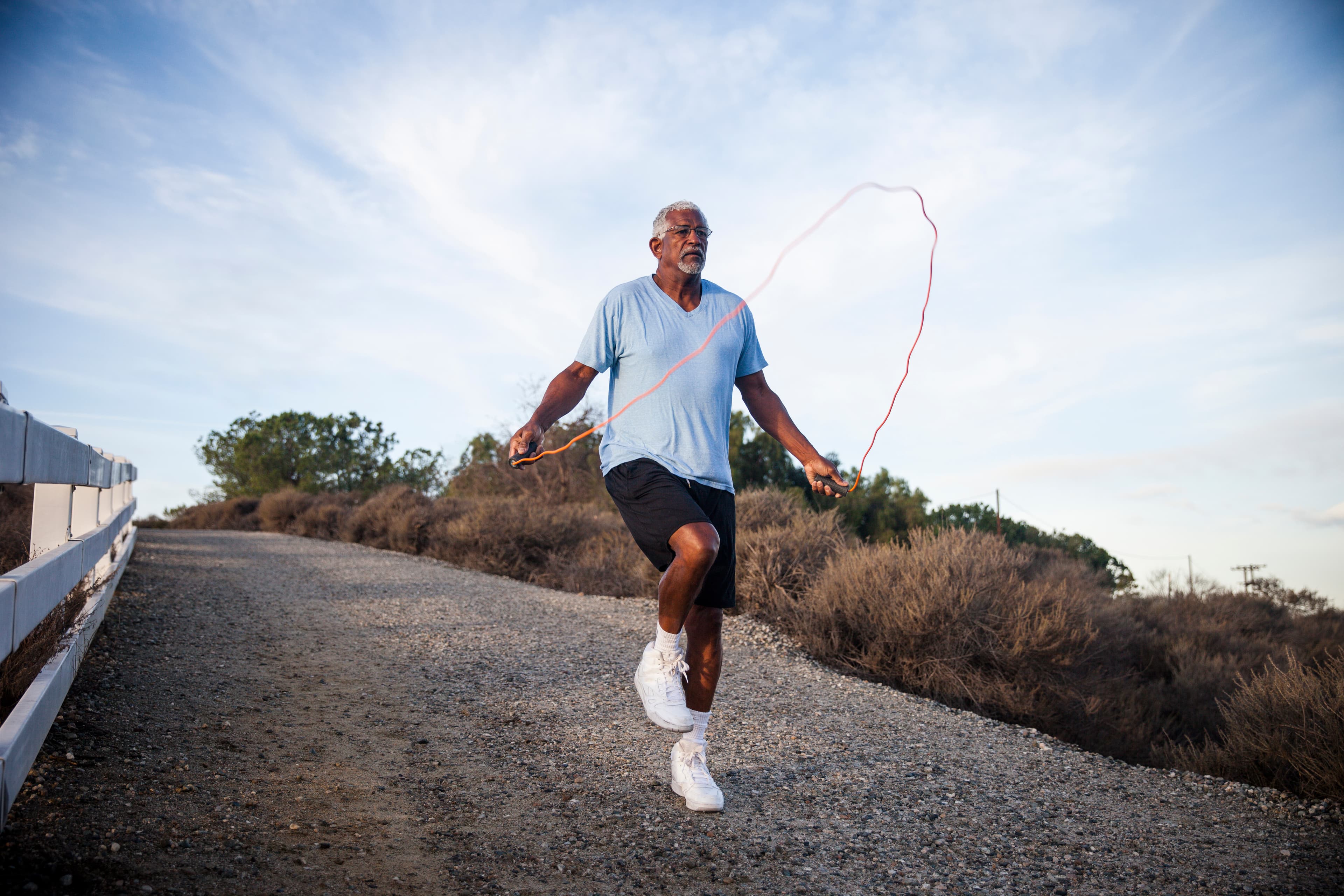 A photo of a man skipping rope.