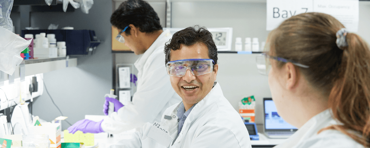 Three researchers working in a lab.