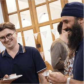 A photo of two Cancer Research supporters at a fundraising event.