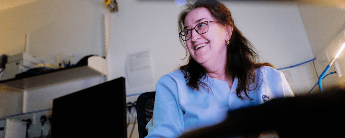 Profile shot of a researcher talking to someone.