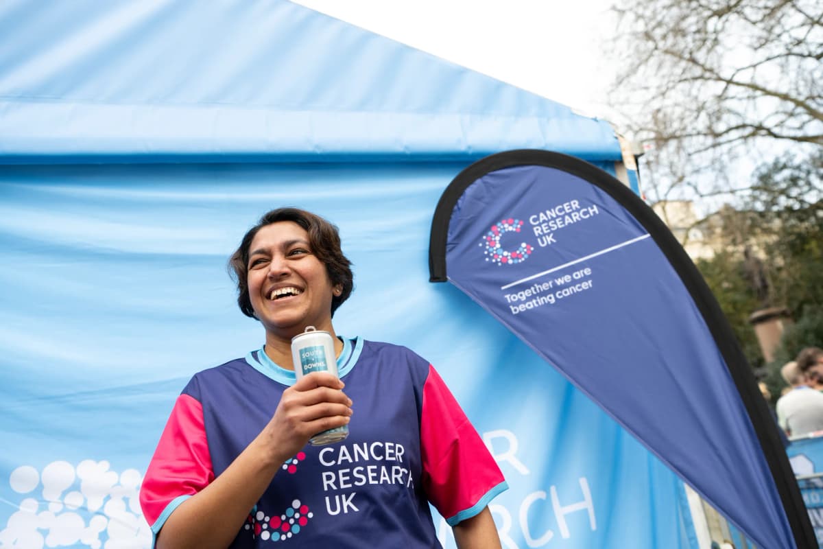 A photo of a person wearing a Cancer Research UK t-shirt.