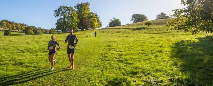 The image captures participants running the North Downs 50 Challenge.