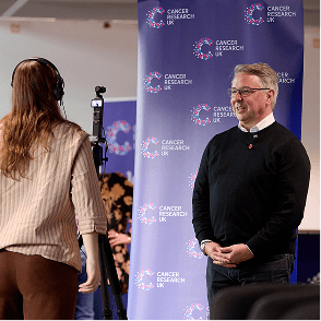 A photo of two Cancer Insights Panel member talking and having a laugh.