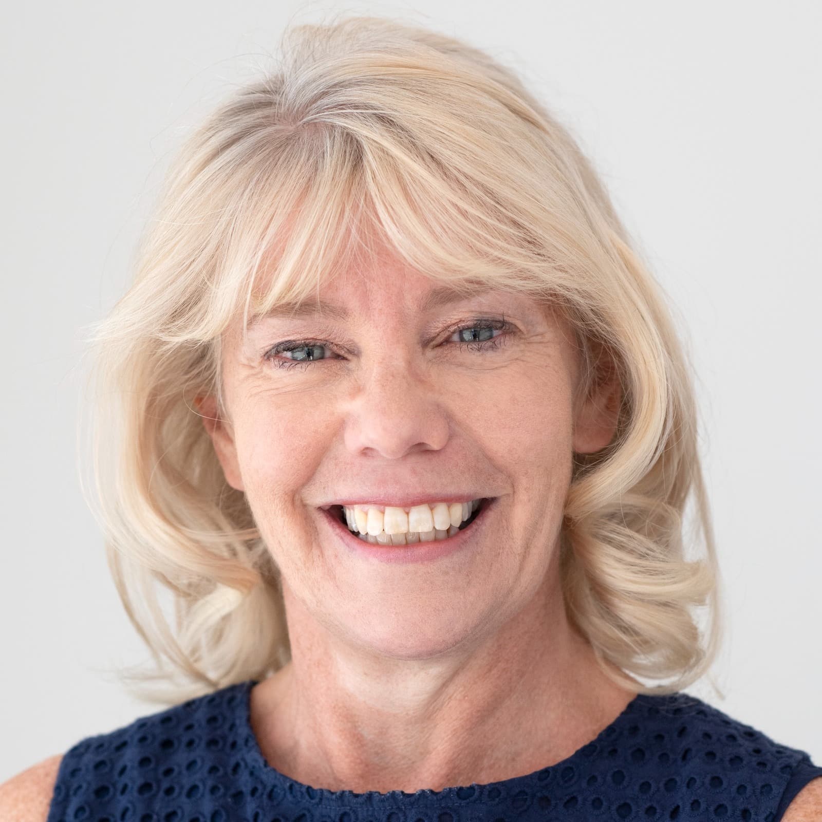 Head shot of Julie George, a Legacy Relationship Manager, smiling.