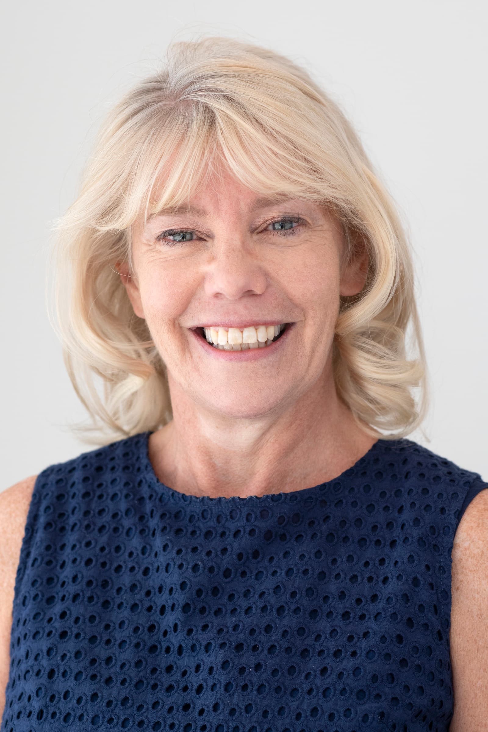 Head shot of Julie George, a Legacy Relationship Manager, smiling.