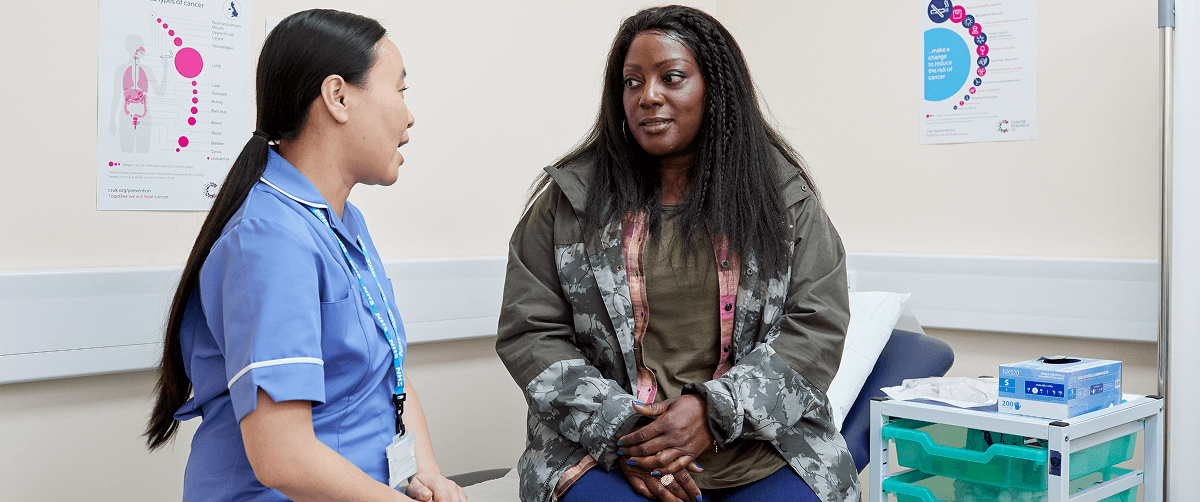 A photo of a nurse with a patient.