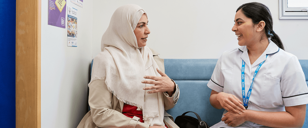 A photo of a nurse and a patient.