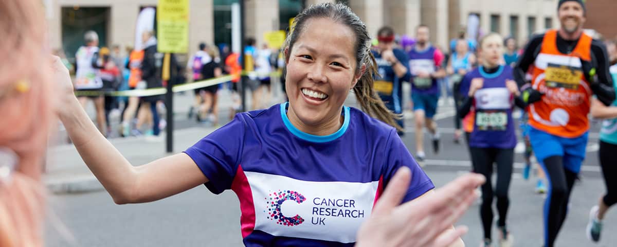 Marathon runner completing race.