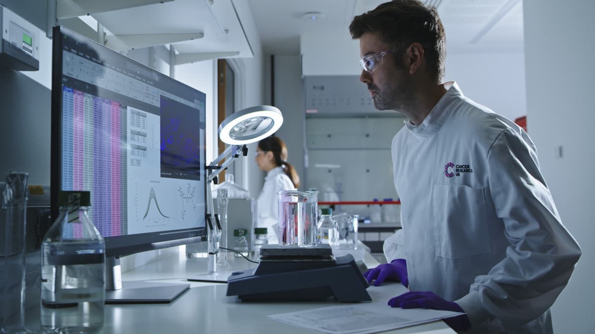 One of our determined researchers looking at a computer screen in a lab.