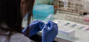 A female scientist preparing samples in a laboratory