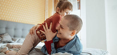 A woman playing with her daughter