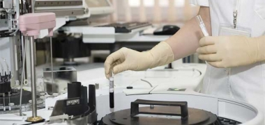 Researcher with lab samples