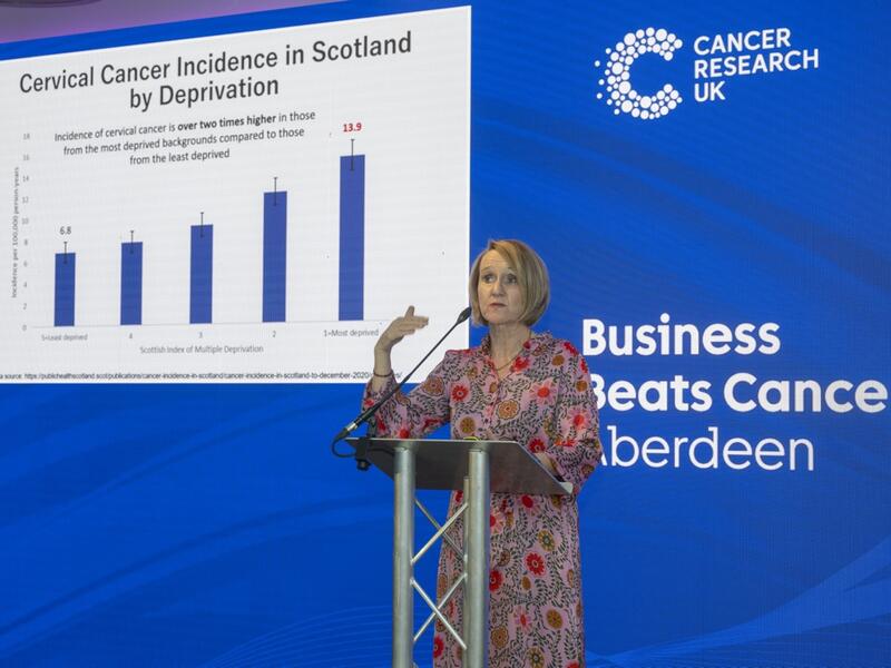 Presenter speaking at Business Beats Cancer Aberdeen event