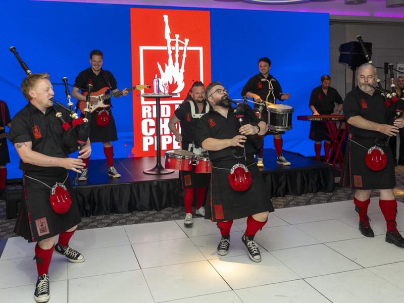 Scottish pipe band in traditional attire performing