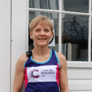 Mary Twitchett smiling wearing a CRUK vest