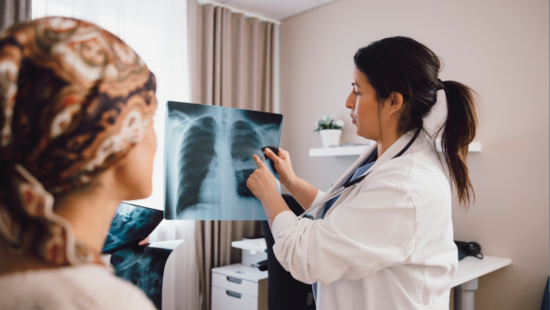Dr showing patient a x-ray of lungs  Dr showing patient a x-ray of lungs