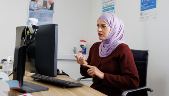 GP talking on a video call at their practice