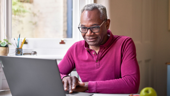 Man using his laptop at home