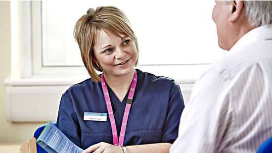 Nurse explaining information to a cancer patient