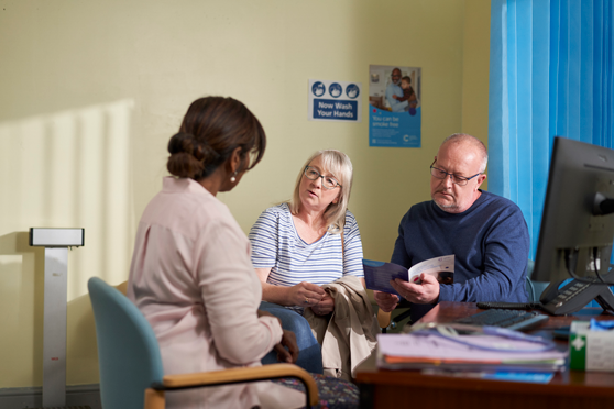 Image of a couple talking with a health professional