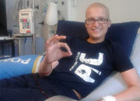 A photo of Adam smiling