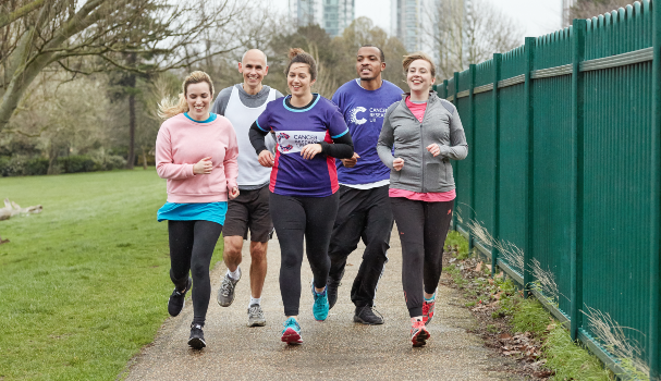 CRUK event participants running through a park