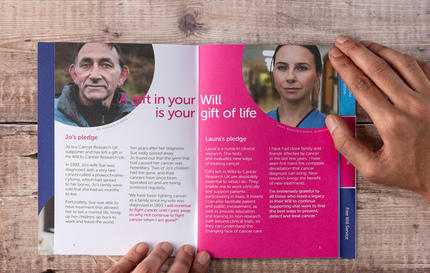 A physical copy of the CRUK gifts in wills guide opened on a table by two hands A physical copy of the CRUK gifts in wills guide opened on a table by two hands