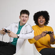 2 people playing with a games console