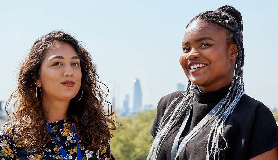 A photo of two people outside smiling