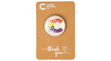 An illustration of a Pride-inspired CRUK pin 