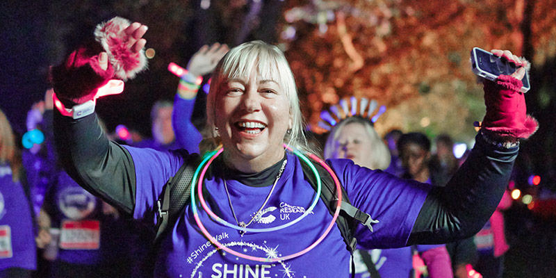 Photo of a fundraiser celebrating during their Shine Night Walk