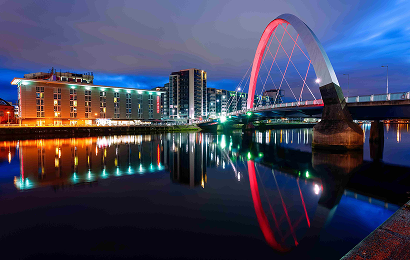 Image of The Clyde Arc in Glasgow lit up at night