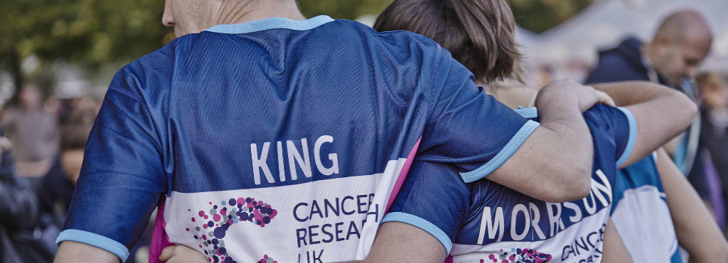Cancer Research UK Runners with their arms around each other