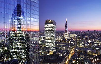 view over the city of london at night, including the shard and the walkie talkie building