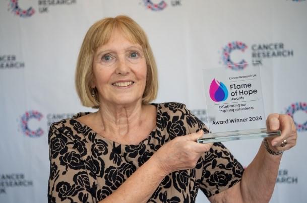 Marilyn with her flame of hope award