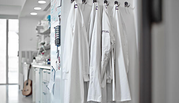 Labcoats hanging in a lab
