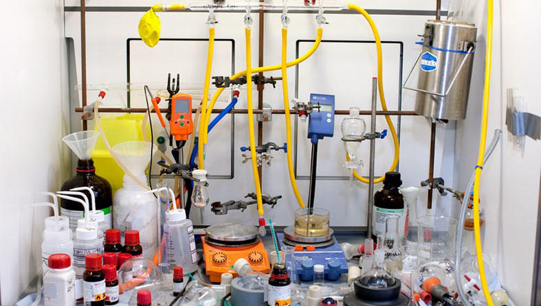 Bottles and equipment in a fume cupboard