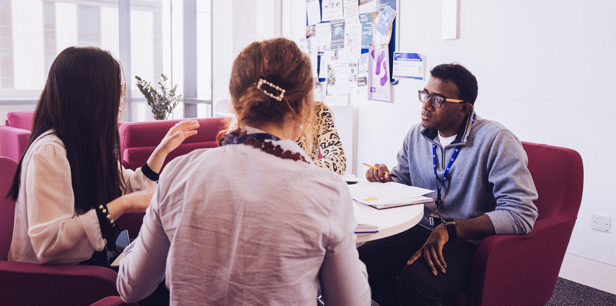 Researchers engaged in conversation