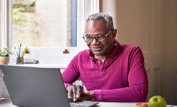 A man at home on his laptop 