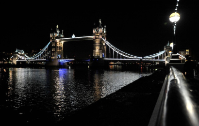 Image of tower bridge in London lit up at night