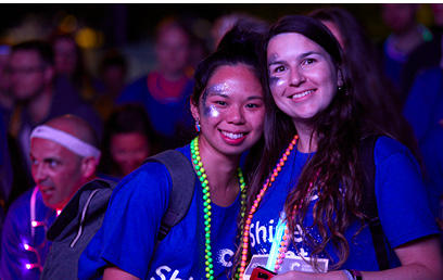 About Shine Night Walk Leeds Two women smiling at the camera at Shine Night Walk
