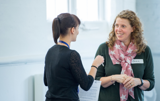 2 women talking to each other