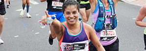 Woman running for Cancer Research UK