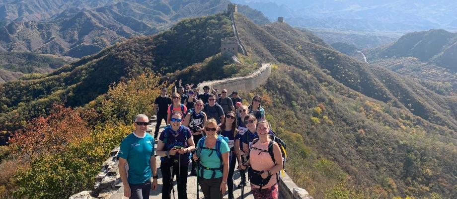 View of Great Wall of China with Cancer Research supporters smiling for a photo