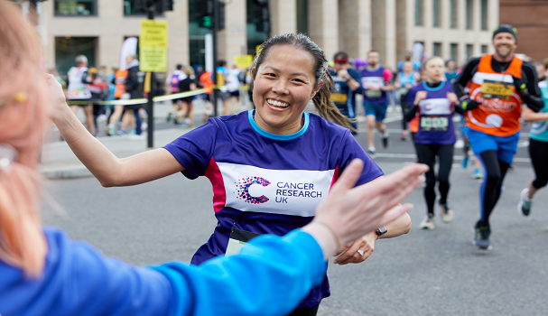 Woman smiling whilst running