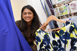 A lady holding a blouse