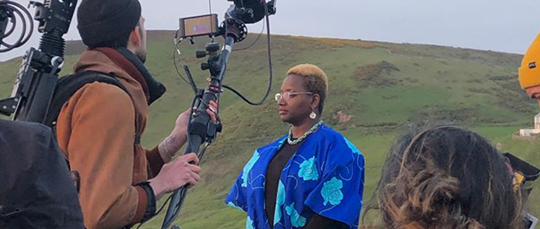 bami on cliff with film crew